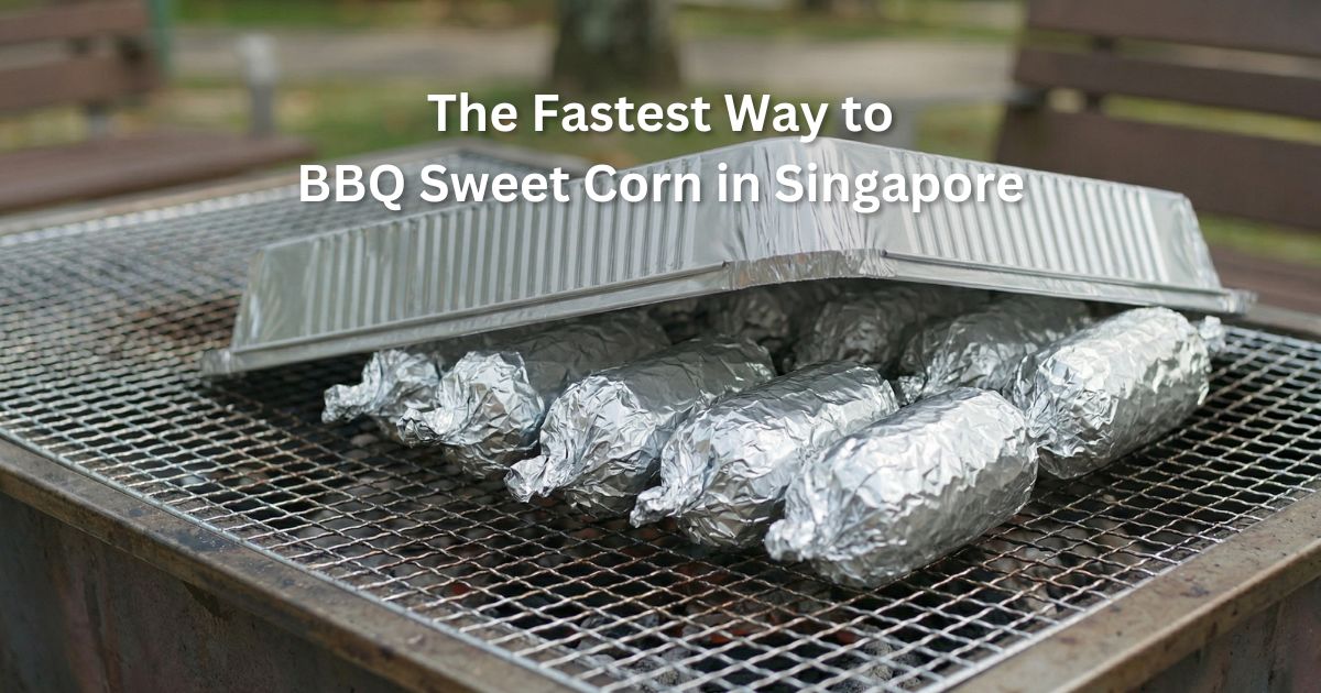 Sweet corn wrapped in foil grilling on BBQ pit in Singapore park